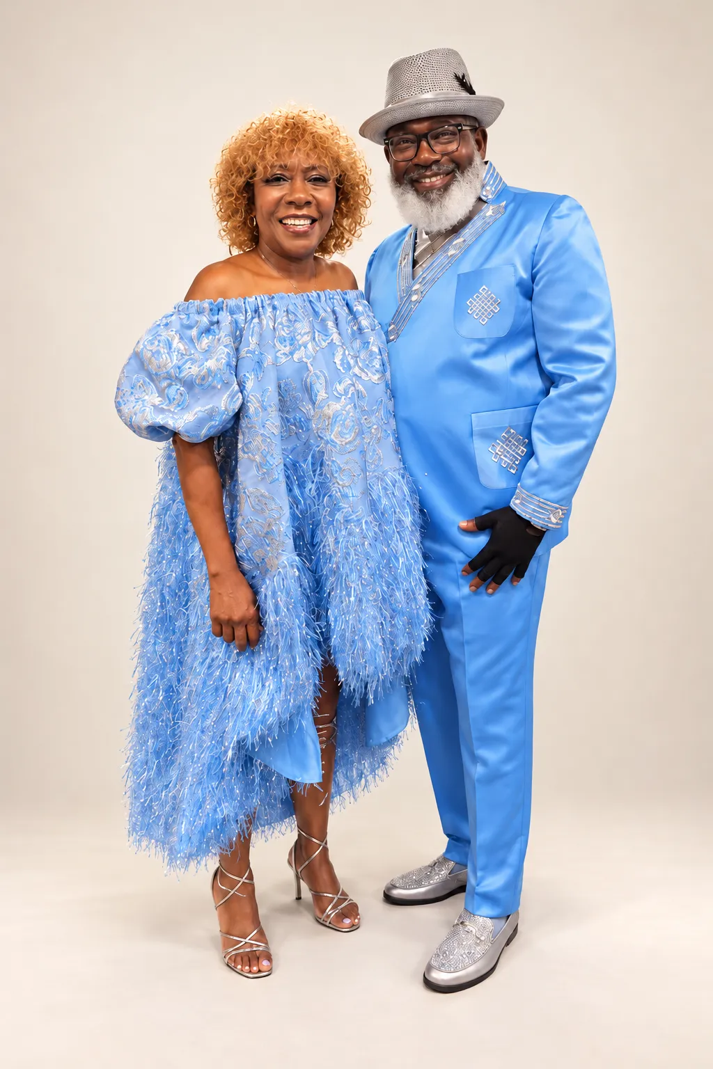 Matching blue feathered dress and embroidered satin suit